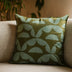 Aruna handmade cotton batik throw pillow in khaki green on seafoam blue, 18" x 18", by Kohomba Life.