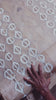 An artisan creates signature crackle patterns in batik placemats as part of Kohomba’s handcrafted home decor process.
