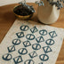 Teal Blue on Rye Thrigona handmade batik dining placemat, 18" x 14" from Kohomba Life.
